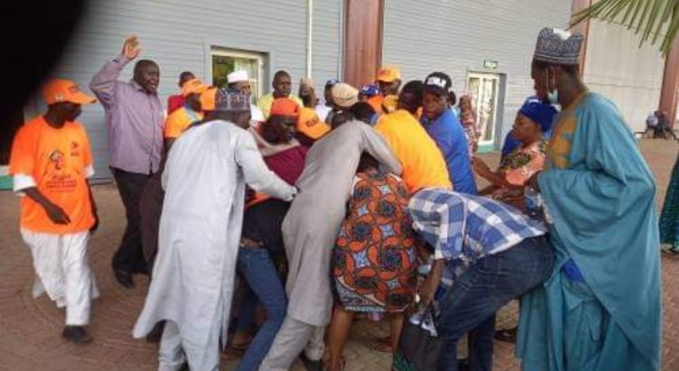 Tinubu's supporters throw punches at each other while distributing money.